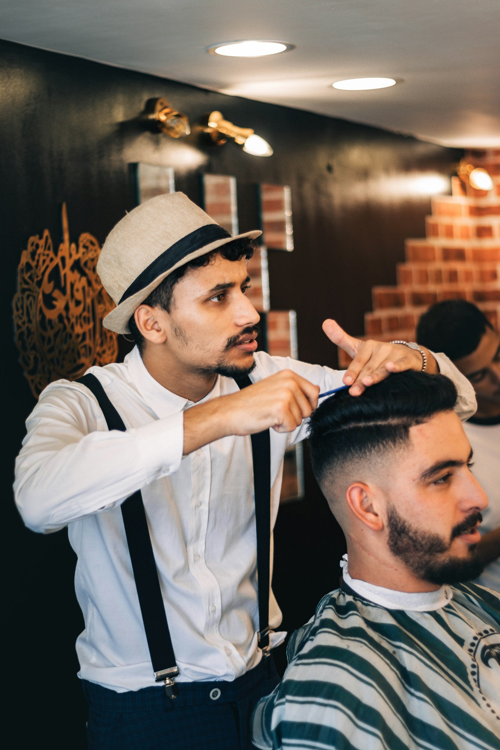 Barber cutting a client's hair